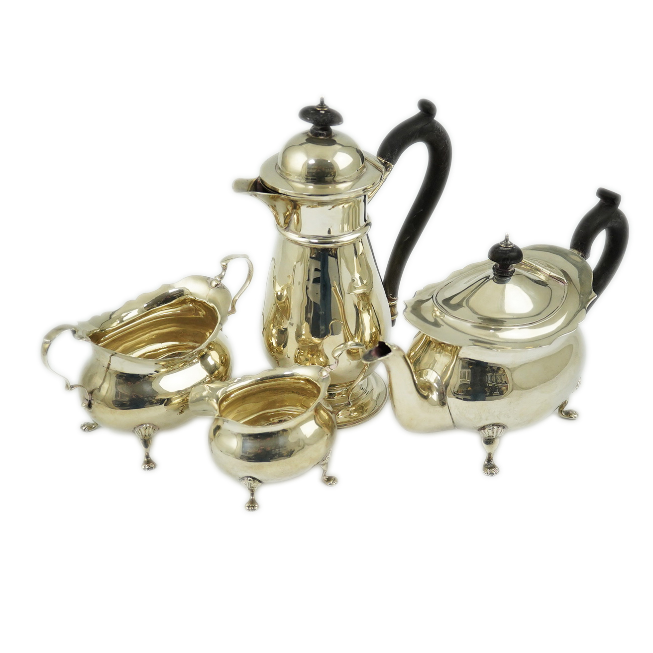 A late Victorian silver four piece tea set by Walker & Hall